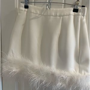White skirt with feather trim new with tags.   Great for bride to be